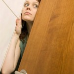 woman_hiding_behind_door_clf00202-150x150.jpg